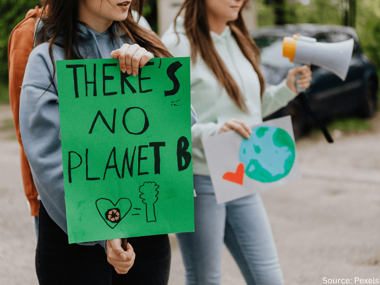 people holding sign saying there's no plant b